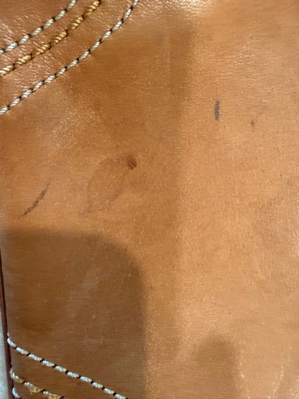 Coach Tan Leather Wristlet with Black Strap , It's staine in some places
